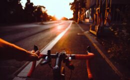 person riding on bicycle on road